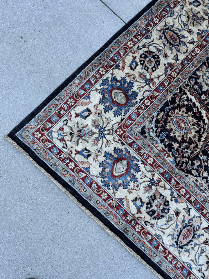 9x12 Handmade Afghan Wool Rug | Black Floral Garden Area Rug with Ivory Border | Red and Blue Accents | Hand-Knotted Traditional Carpet